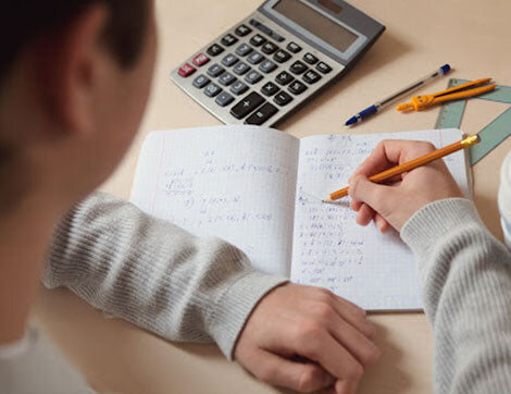 A student writing an examination paper