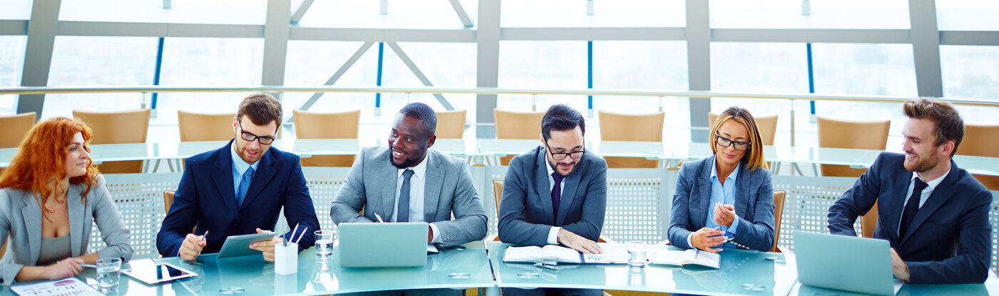 A diverse team of Career Calling International professionals collaborate during a business meeting.